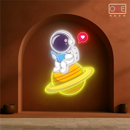 Enseigne néon LED artistique astronaute mignon en train de lire